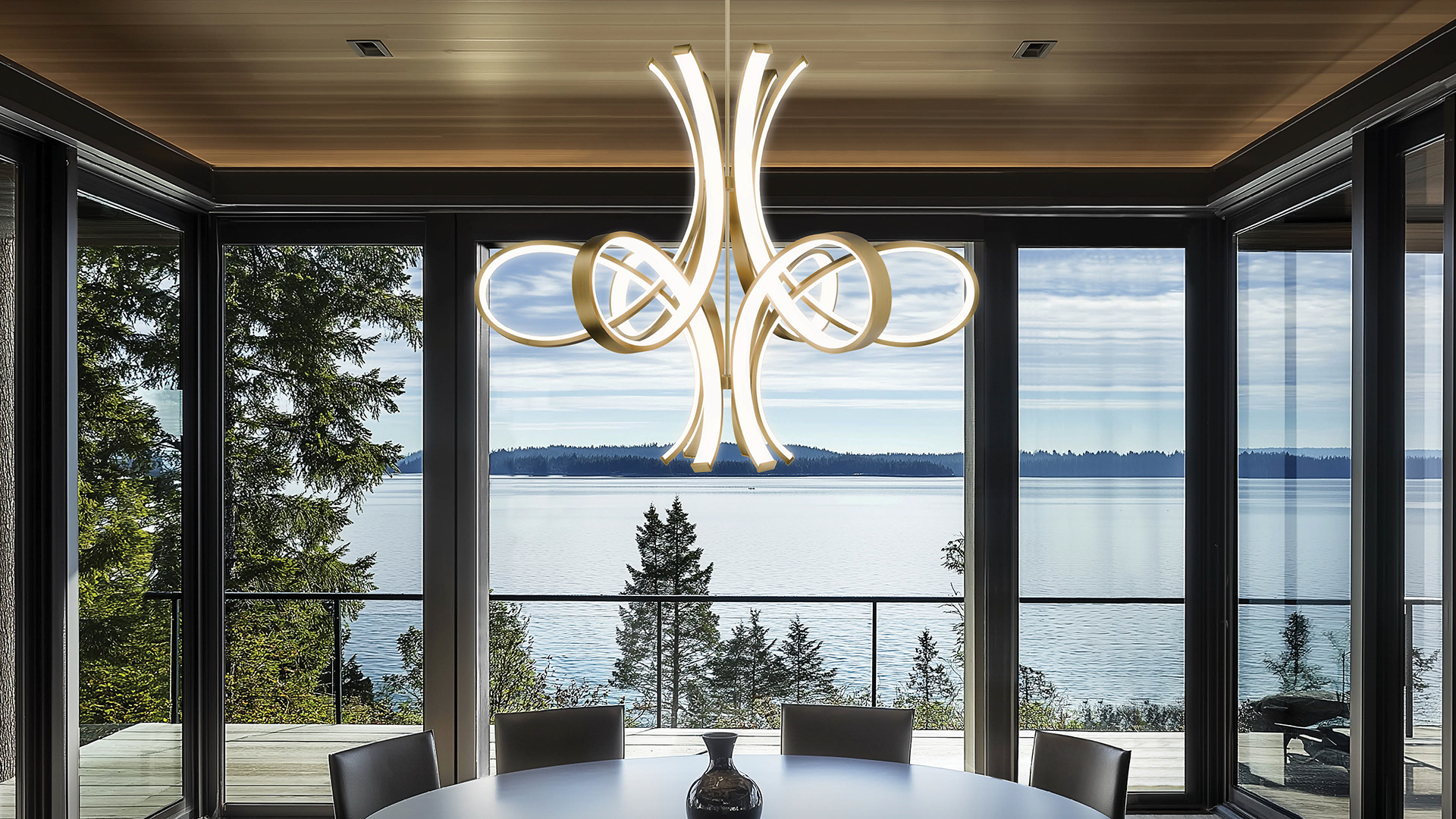 Fleur de Lis LED luxry Modern Forms chandelier over dining room table